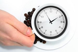 Clock inside coffee cup