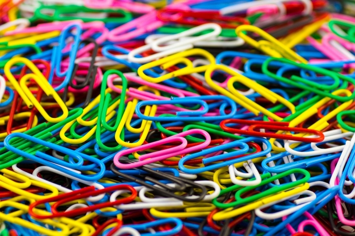 Pile of multi-colored messy paper clips